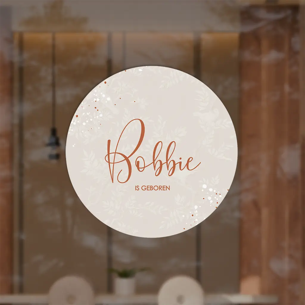 Raamsticker rond met beige achtergrond en takjes