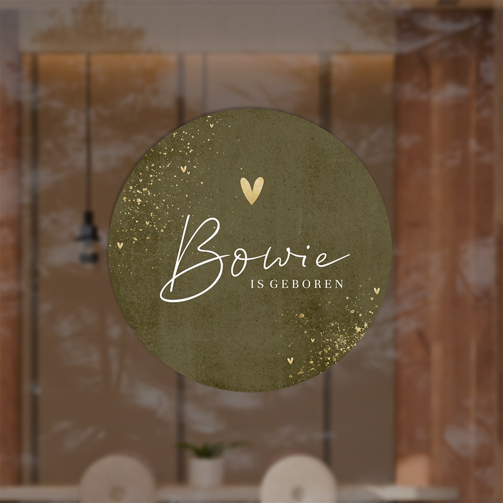 Raamsticker rond met groene achtergrond en verfspetters