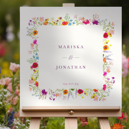 Vrolijk welkomstbord voor jullie bruiloft met kleurrijke veldbloemen