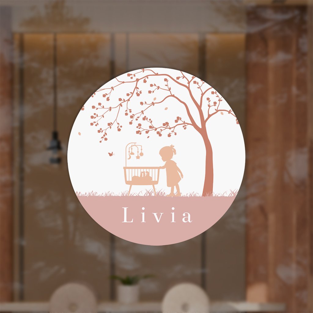 Romantische raamsticker met wiegje in landschap