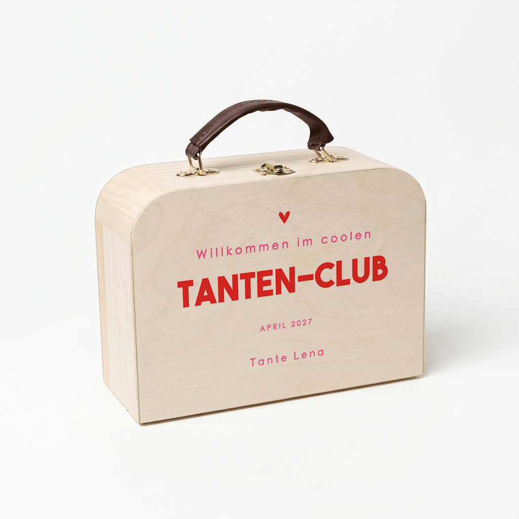 Kinderkoffer als Schwangerschaftsankündigung für Tanten