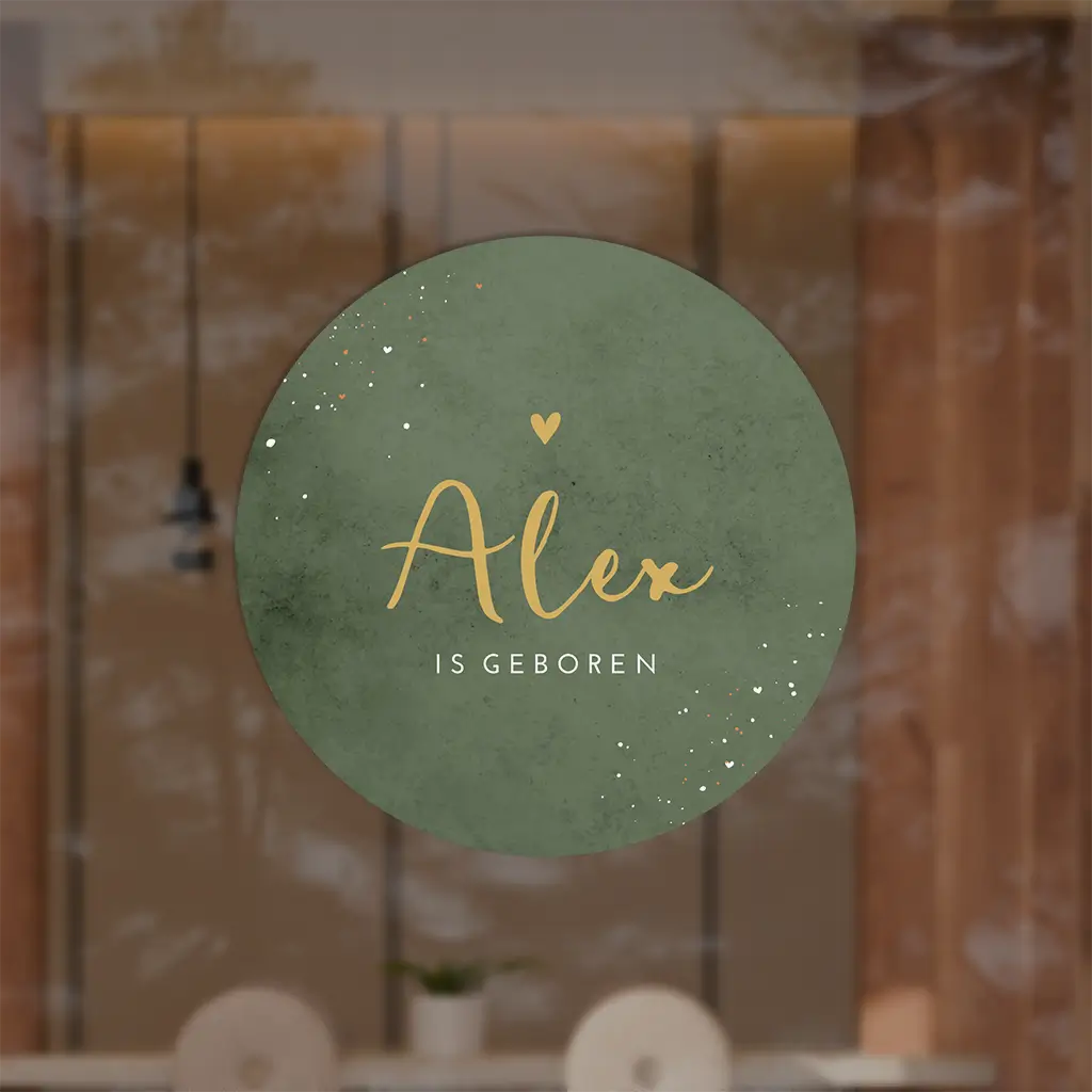 Raamsticker rond met groene velvet-look achtergrond en oranje letters