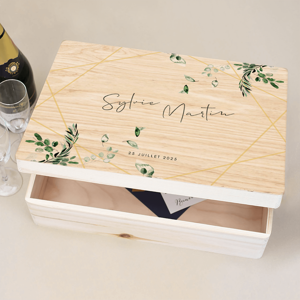 Boîte de souvenir en bois avec des branches vertes et de la géométrie