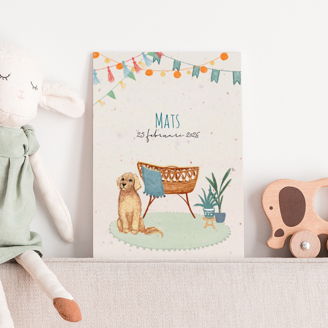 Geboortekaartje met een wiegje, vlaggetjes en huisdier