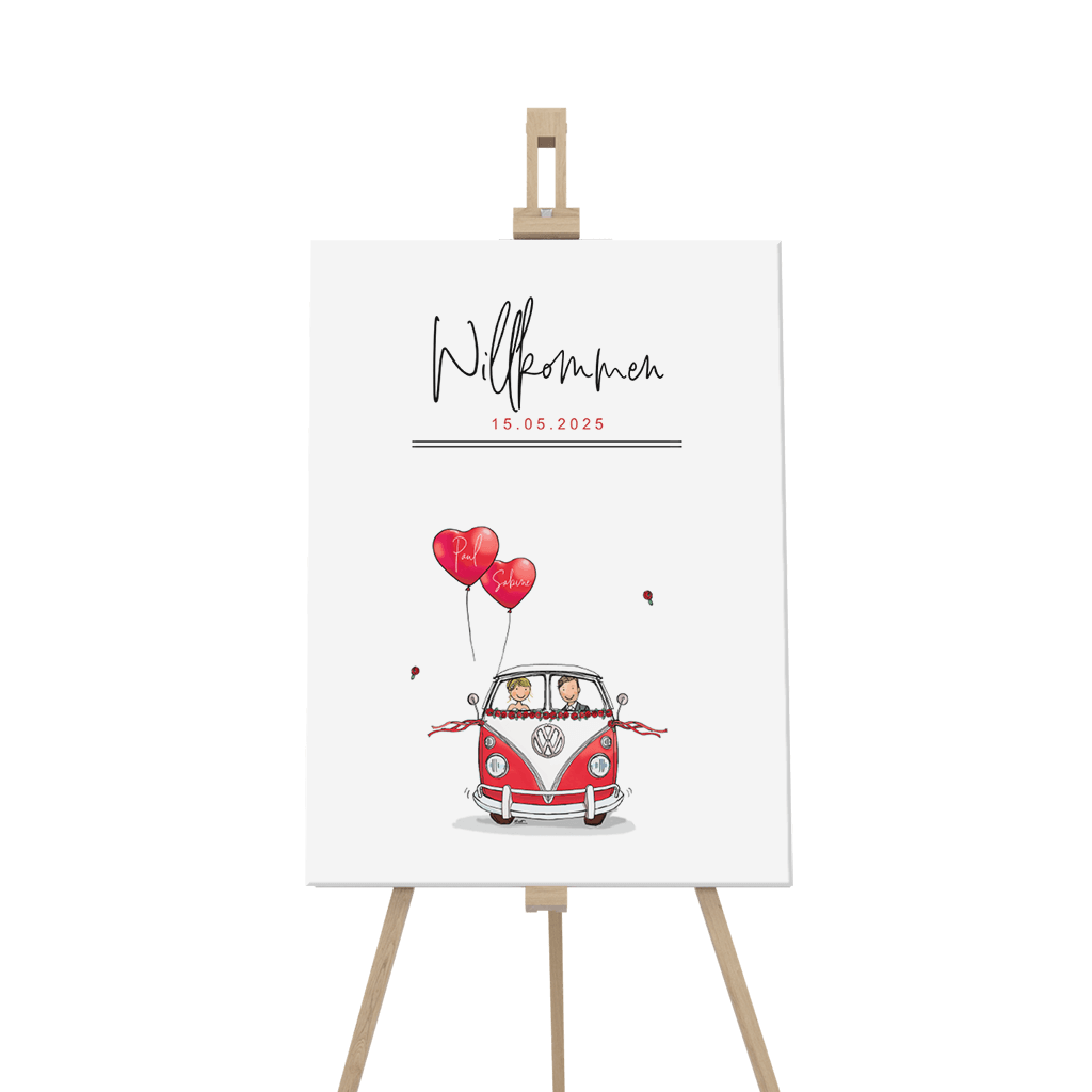 Willkommensschild zum Jubiläum mit rotem Van und Ballons