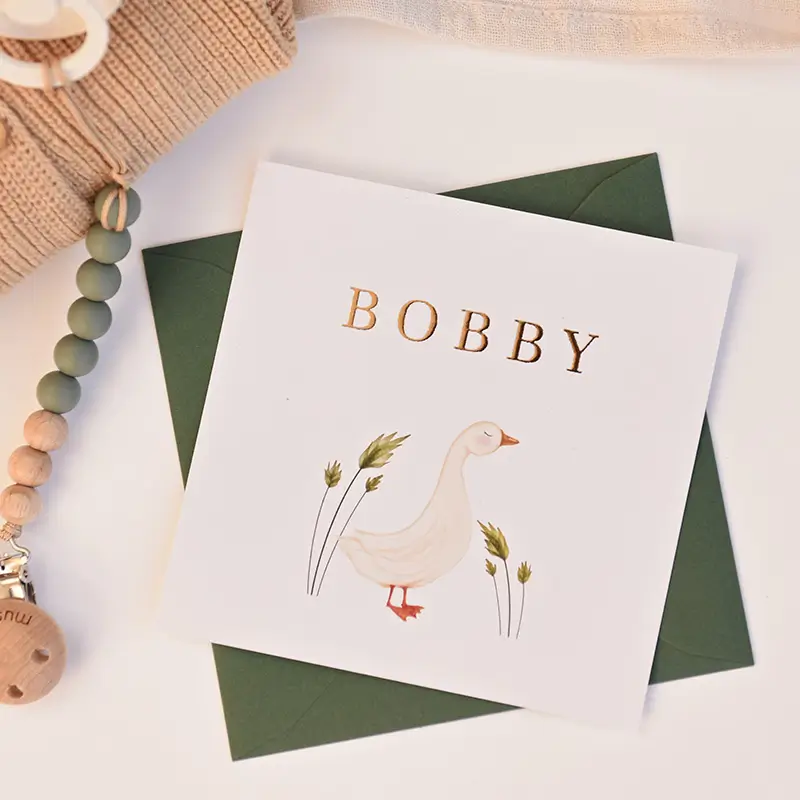 Lief goudfolie geboortekaartje met illustratie van gansje