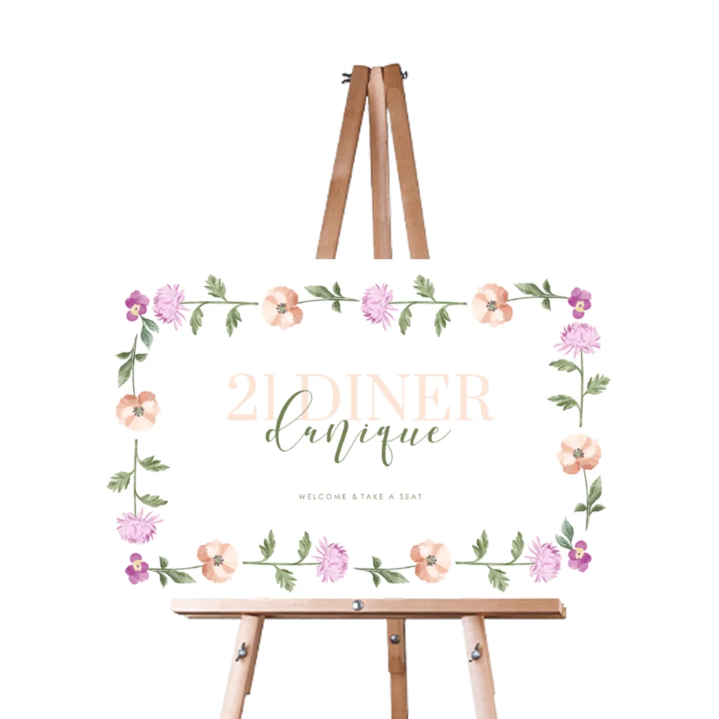 Kleurrijk welkomstbord twenty one dinner met bloemenkrans