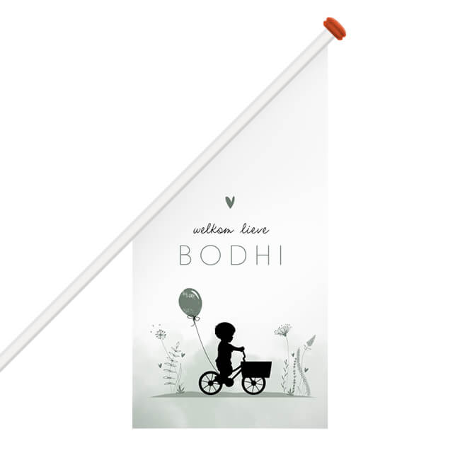 Silhouet geboortevlag jongen op fiets met ballon