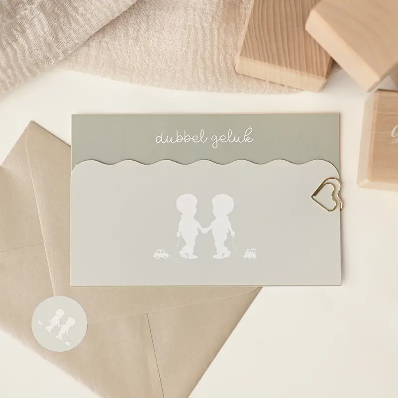 Origineel label geboortekaartje tweeling met silhouetjes en golfrandje