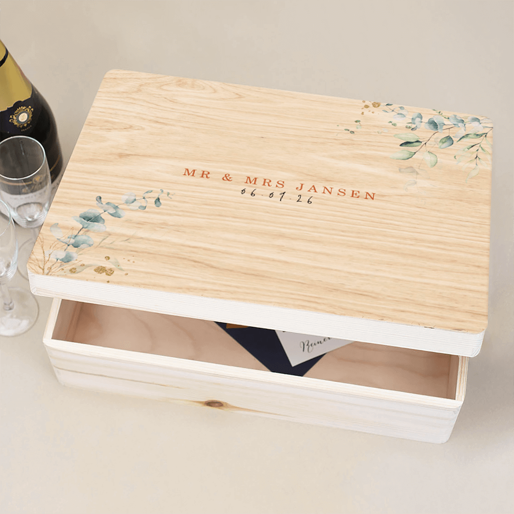 Houten bewaarkist met takjes en gouden spetters