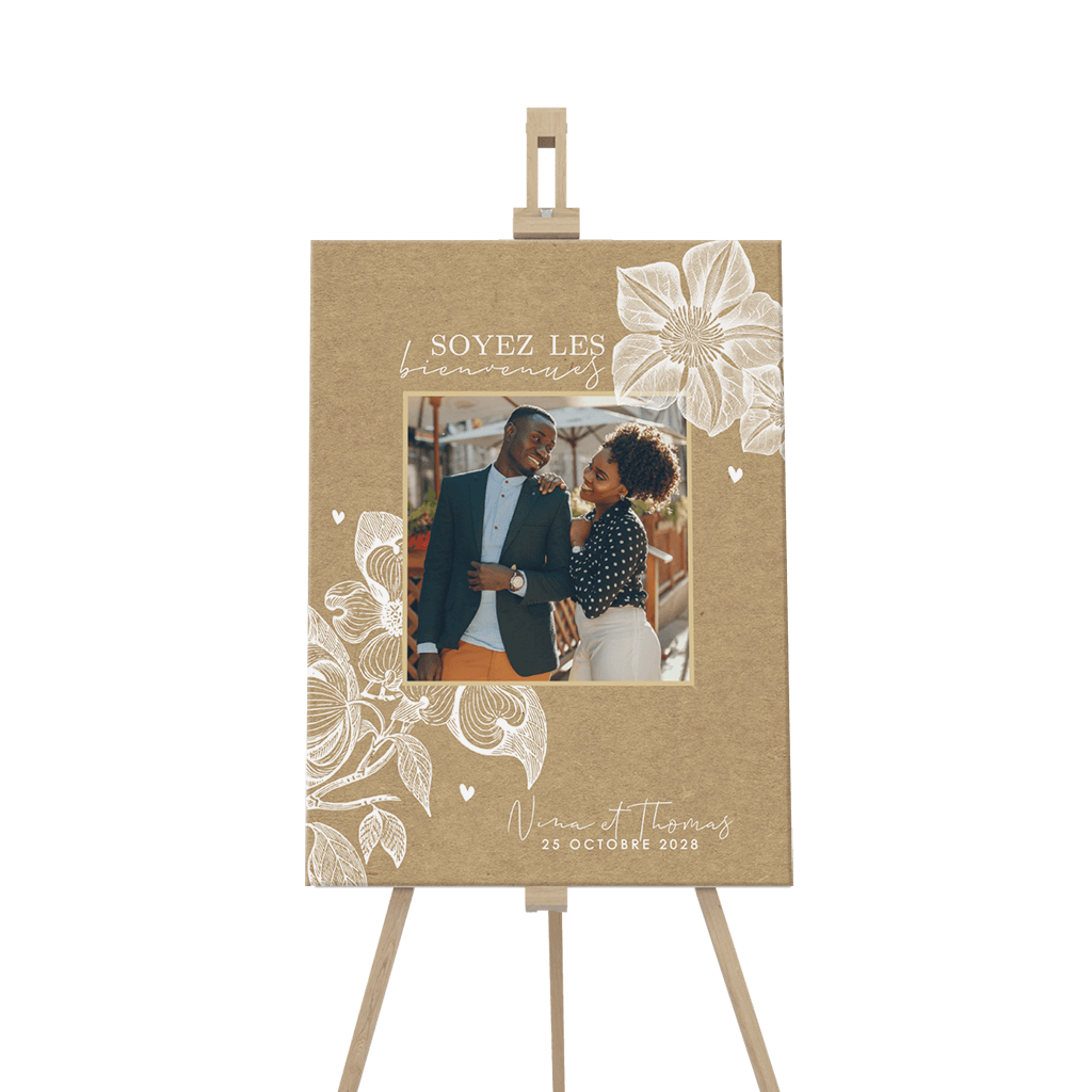 Panneau de bienvenue avec des fleurs blanches et une photo