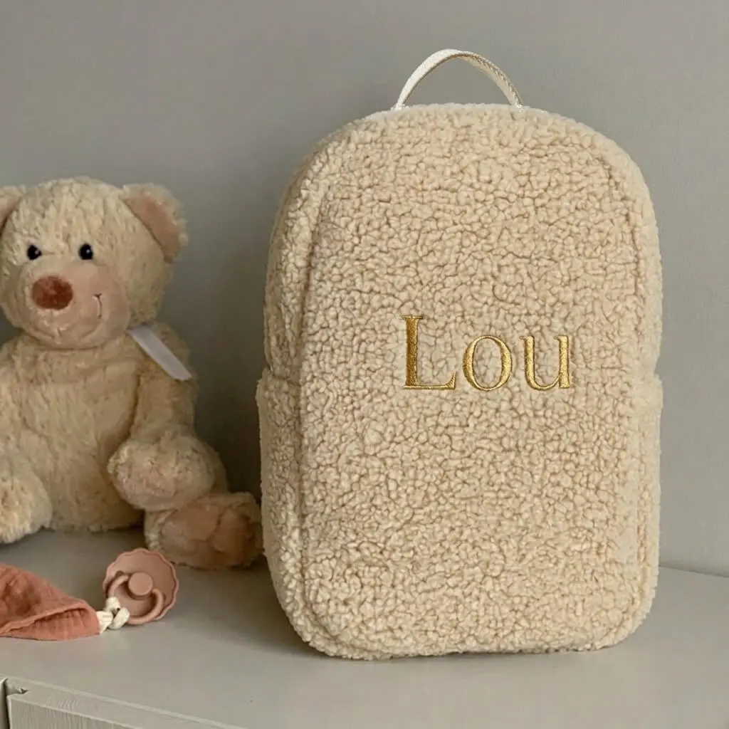 Teddy rugtas met naam geborduurd