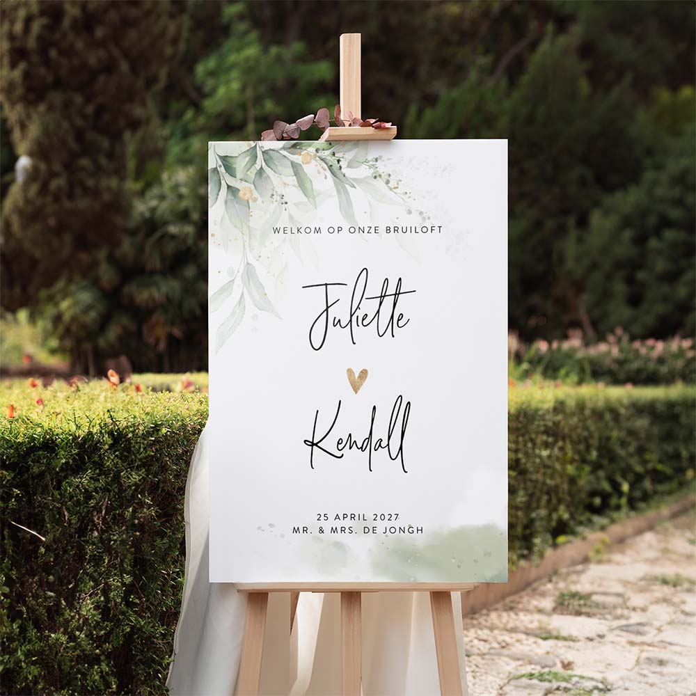 Welkomstbord met groene botanische bladeren