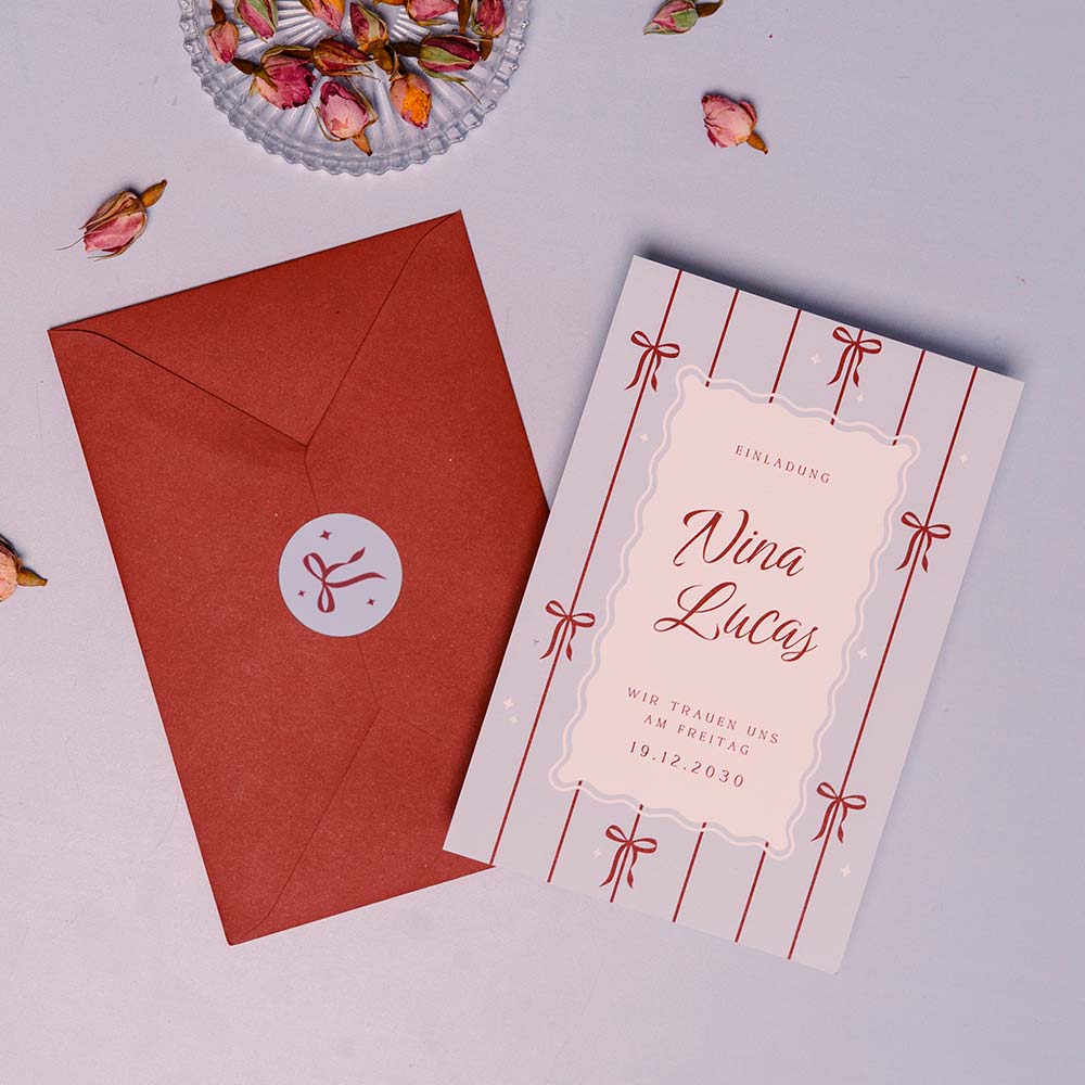 Winterliche Hochzeitskarte mit Schleifen und verspieltem Rahmen